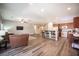 Open concept living space featuring kitchen, bar seating and living room at 7252 Blowing Breeze Ave, Las Vegas, NV 89179