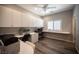 Bright office space with custom built-ins, desk, and wood-look floors perfect for working from home at 7252 Blowing Breeze Ave, Las Vegas, NV 89179