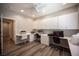 Spacious office featuring custom cabinetry, built-in desk, and plenty of room for multiple workstations at 7252 Blowing Breeze Ave, Las Vegas, NV 89179