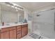 Bathroom with dual sink vanity and glass enclosed shower at 7960 Calito St, Las Vegas, NV 89166