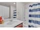 Bathroom with a vanity, a mirror, and a shower-tub combo at 7960 Calito St, Las Vegas, NV 89166