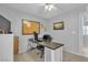 Home office with carpet flooring features a desk and a cork board at 7960 Calito St, Las Vegas, NV 89166