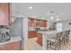 Kitchen boasts granite countertops, stainless steel appliances, and wood cabinets at 7960 Calito St, Las Vegas, NV 89166