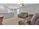 Inviting carpeted loft featuring plush seating, ideal for a cozy retreat or entertainment space at 7960 Calito St, Las Vegas, NV 89166