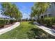 Neighborhood park with green grass and a playground, providing a great outdoor space for families and children at 7960 Calito St, Las Vegas, NV 89166