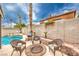 Charming backyard features a sparkling pool, spa, and outdoor seating area, creating the perfect retreat at 8737 Autumn Valley Ave, Las Vegas, NV 89129