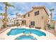 Expansive backyard featuring a sparkling pool, covered patio, and lush landscaping, ideal for outdoor entertaining at 8737 Autumn Valley Ave, Las Vegas, NV 89129