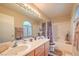 Full bathroom featuring tiled tub-shower combo and double sinks at 8737 Autumn Valley Ave, Las Vegas, NV 89129