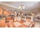 Open kitchen and dining area featuring stainless steel appliances and a basement bar area at 8737 Autumn Valley Ave, Las Vegas, NV 89129