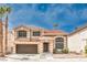 Charming two-story home with a red tile roof, two palm trees, and a two-car garage in a suburban neighborhood at 8737 Autumn Valley Ave, Las Vegas, NV 89129