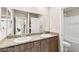 Bathroom featuring a dual sink vanity with attractive countertop, and a shower/tub at 8937 Pelican Point St, Las Vegas, NV 89178