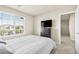 Cozy bedroom with a bed, large window, and a dark dresser at 8937 Pelican Point St, Las Vegas, NV 89178