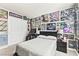 A Raiders/Pop Culture themed room features a computer desk and collectibles throughout at 8937 Pelican Point St, Las Vegas, NV 89178