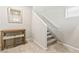 Entryway features a hall table with seating and carpeted stairs leading to the upper level at 8937 Pelican Point St, Las Vegas, NV 89178
