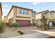 Modern two-story home with a brick driveway, and well-maintained landscaping at 8937 Pelican Point St, Las Vegas, NV 89178