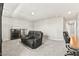 A well-lit game room provides seating, cabinets, desk, and access to the hallway at 8937 Pelican Point St, Las Vegas, NV 89178