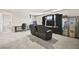 Spacious game room includes TV, seating, desk, and cabinets at 8937 Pelican Point St, Las Vegas, NV 89178