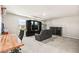 Large game room with a TV, cabinets, and a desk at 8937 Pelican Point St, Las Vegas, NV 89178