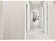 Neutral hallway featuring carpet and white trim at 8937 Pelican Point St, Las Vegas, NV 89178