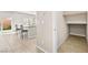 Bright kitchen with breakfast bar that opens to a walk-in closet at 8937 Pelican Point St, Las Vegas, NV 89178