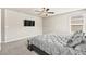The main bedroom features a ceiling fan, plush carpet and ensuite bathroom at 8937 Pelican Point St, Las Vegas, NV 89178