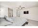 Bright main bedroom features ceiling fan, plush carpet, and ensuite bathroom at 8937 Pelican Point St, Las Vegas, NV 89178