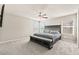 Large main bedroom with a ceiling fan, neutral carpet, and plenty of natural light at 8937 Pelican Point St, Las Vegas, NV 89178