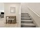 Carpeted staircase leads to the upper level, adjacent to a small breakfast table at 8937 Pelican Point St, Las Vegas, NV 89178