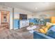 Relaxing living room with entertainment center, couch and natural light, creates a welcoming and functional area at 1194 Dre Harbor Pl # Lot 87, North Las Vegas, NV 89084