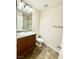 Bathroom featuring a vanity with granite countertops and a shower with glass doors at 12021 Spice Tree St, Las Vegas, NV 89183