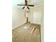 This is a bright carpeted bedroom with standard closet and ceiling fan at 12021 Spice Tree St, Las Vegas, NV 89183