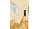 An upstairs hallway with carpeted floors and stairs and small windows at 12021 Spice Tree St, Las Vegas, NV 89183