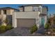 Charming two-story home featuring a modern design, attached garage, and well-maintained front yard at 1556 Pacific Baza St, Las Vegas, NV 89138