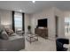 Comfortable living room with plush seating, a large TV, and stylish decor at 1556 Pacific Baza St, Las Vegas, NV 89138