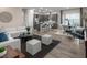 Bright living room with contemporary furnishings, flowing into kitchen and dining areas at 1556 Pacific Baza St, Las Vegas, NV 89138