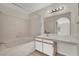 Bathroom features vanity, tub with shower, and large mirror at 2200 S Fort Apache Rd # 1101, Las Vegas, NV 89117