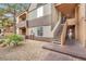 Two-story condominium exterior showcasing outdoor staircase access and landscaping at 2200 S Fort Apache Rd # 1101, Las Vegas, NV 89117