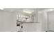Bright kitchen featuring white cabinets, breakfast bar, and white appliances at 2200 S Fort Apache Rd # 1101, Las Vegas, NV 89117