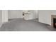 Spacious living room featuring gray carpet and fireplace, flowing into the kitchen area at 2200 S Fort Apache Rd # 1101, Las Vegas, NV 89117