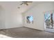Bright bedroom with vaulted ceiling, large window, and slider access to balcony at 2204 Ambermill Ct, Henderson, NV 89052