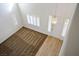 Bright entryway with hardwood flooring and chandelier lighting at 2204 Ambermill Ct, Henderson, NV 89052