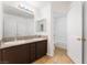 Bathroom has double sinks, granite countertops, and a walk-in shower at 2400 Dutchmans Pipe Ct, Las Vegas, NV 89106