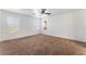 Carpeted bedroom features ceiling fan and natural light at 2400 Dutchmans Pipe Ct, Las Vegas, NV 89106