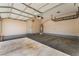 Spacious garage featuring sealed concrete floors, overhead storage, and room for multiple vehicles at 2400 Dutchmans Pipe Ct, Las Vegas, NV 89106