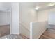 Upstairs hallway features wood flooring and neutral paint at 2400 Dutchmans Pipe Ct, Las Vegas, NV 89106