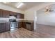 Bright kitchen features stainless steel appliances, granite countertops, and hardwood-style floors at 2400 Dutchmans Pipe Ct, Las Vegas, NV 89106