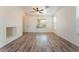 Well-lit living area featuring laminate floors and access to the front entrance at 2400 Dutchmans Pipe Ct, Las Vegas, NV 89106