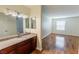 Bathroom featuring a granite countertop vanity and laminate flooring at 2451 N Rainbow Blvd # 1116, Las Vegas, NV 89108