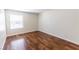Bright bedroom featuring a window with blinds and laminate flooring at 2451 N Rainbow Blvd # 1116, Las Vegas, NV 89108