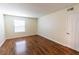 Bright bedroom featuring a window with blinds and laminate flooring at 2451 N Rainbow Blvd # 1116, Las Vegas, NV 89108